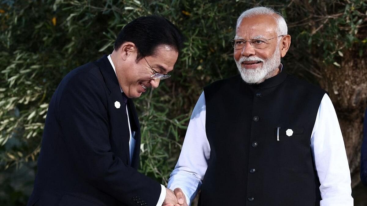 <div class="paragraphs"><p>Prime Minister Narendra Modi shakes hands with Japan’s Prime Minister Fumio Kishida, as G7 leaders and representatives of States and International Organisations gather for a family photo on the second day of the G7 summit at the Borgo Egnazia resort, in Savelletri, Italy</p></div>