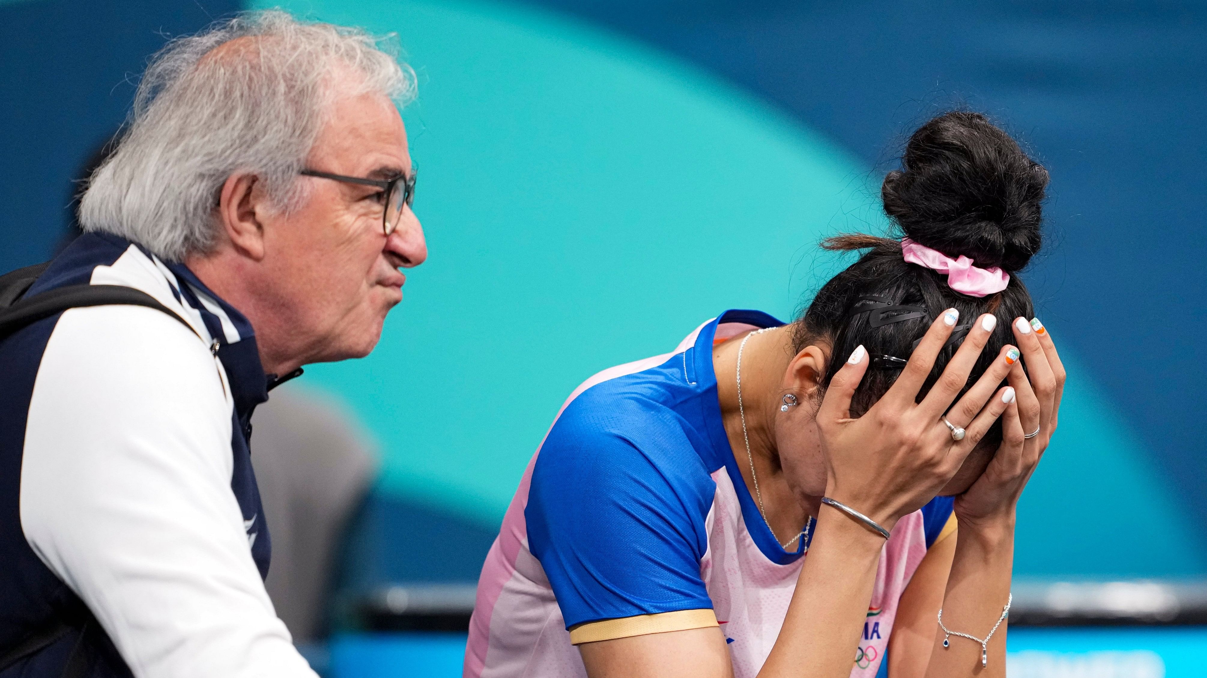 <div class="paragraphs"><p>Manika Batra reacts after losing the women's singles round of 16 table tennis match against Japan's Miu Hirano at the 2024 Summer Olympics, in Paris, France, Wednesday, July 31, 2024.</p></div>