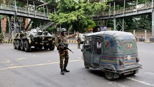 <div class="paragraphs"><p>Members of the Bangladesh Army are seen on duty on the second day of curfew, as violence erupted in parts of the country after protests by students against government job quotas in Dhaka, Bangladesh.</p></div>