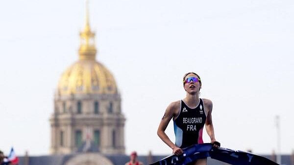 <div class="paragraphs"><p>Cassandre Beaugrand of France reacts after crossing the line to win the gold medal.</p></div>