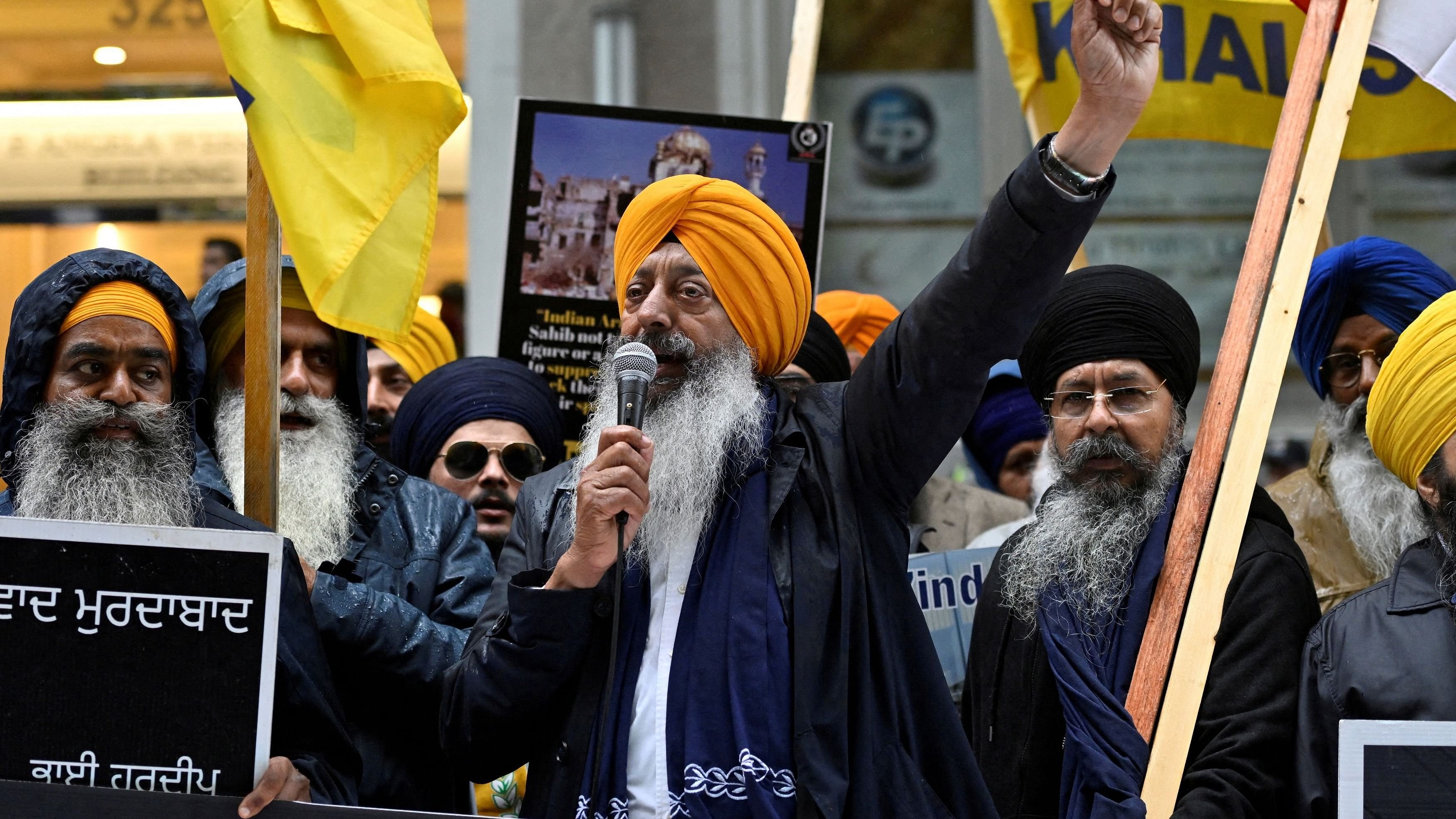 <div class="paragraphs"><p>A demonstrator uses a microphone as others hold flags and signs as they protest outside India's consulate, a week after Canada's Prime Minister Justin Trudeau raised the prospect of New Delhi's involvement in the murder of Sikh separatist leader Hardeep Singh Nijjar.</p></div>