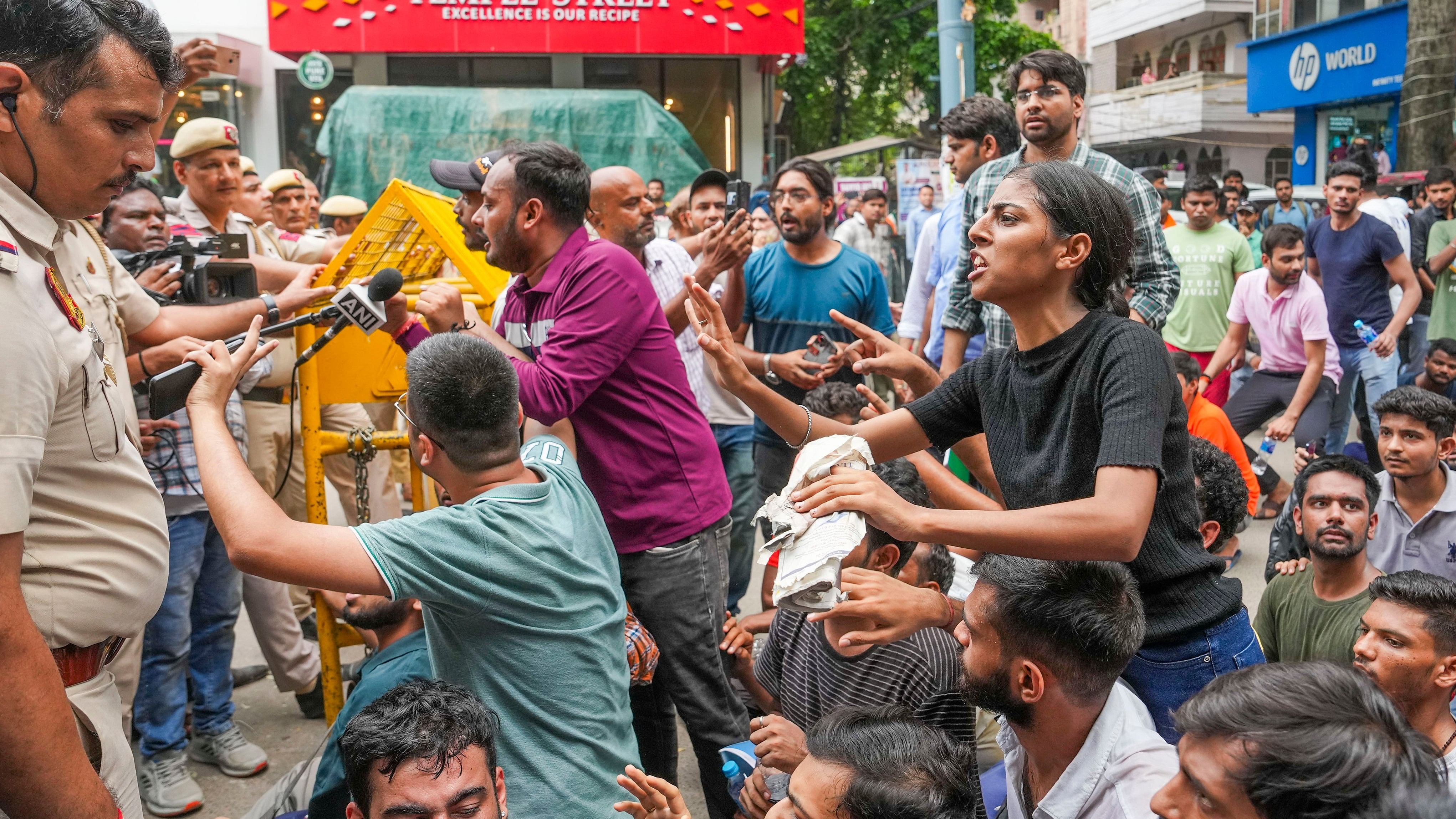 <div class="paragraphs"><p> Students speak to the police personnel during their protest over the deaths of three civil services aspirants due to drowning at a coaching centre in Old Rajinder Nagar area, in New Delhi.</p></div>