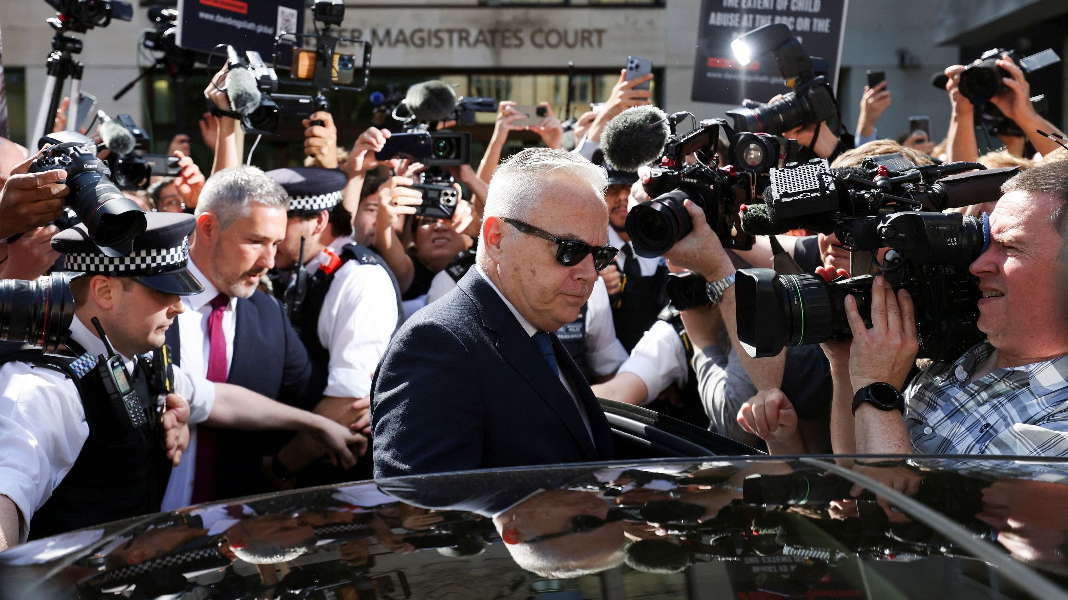 <div class="paragraphs"><p>Former BBC news presenter Huw Edwards gets into a car outside Westminster Magistrates' Court after being charged with indecent child picture crimes on the day of a hearing, in London, Britain, July 31, 2024. </p></div>