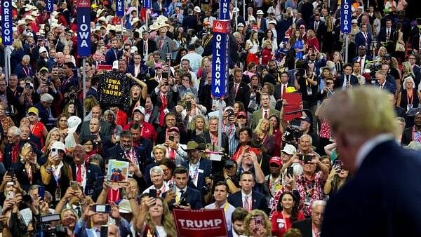 <div class="paragraphs"><p>People look at Republican presidential nominee and former US President Donald Trump during Day 1 of the Republican National Convention (RNC) at the Fiserv Forum in Milwaukee, Wisconsin, US on July 15, 2024.</p></div>