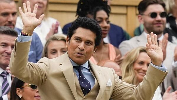 <div class="paragraphs"><p>Former Indian cricketer Sachin Tendulkar reacts as he is introduced on Centre Court ahead of the third round match between Cameron Norrie of Britain and Alexander Zverev of Germany at the Wimbledon tennis championships in London, Saturday, July 6, 2024.</p></div>