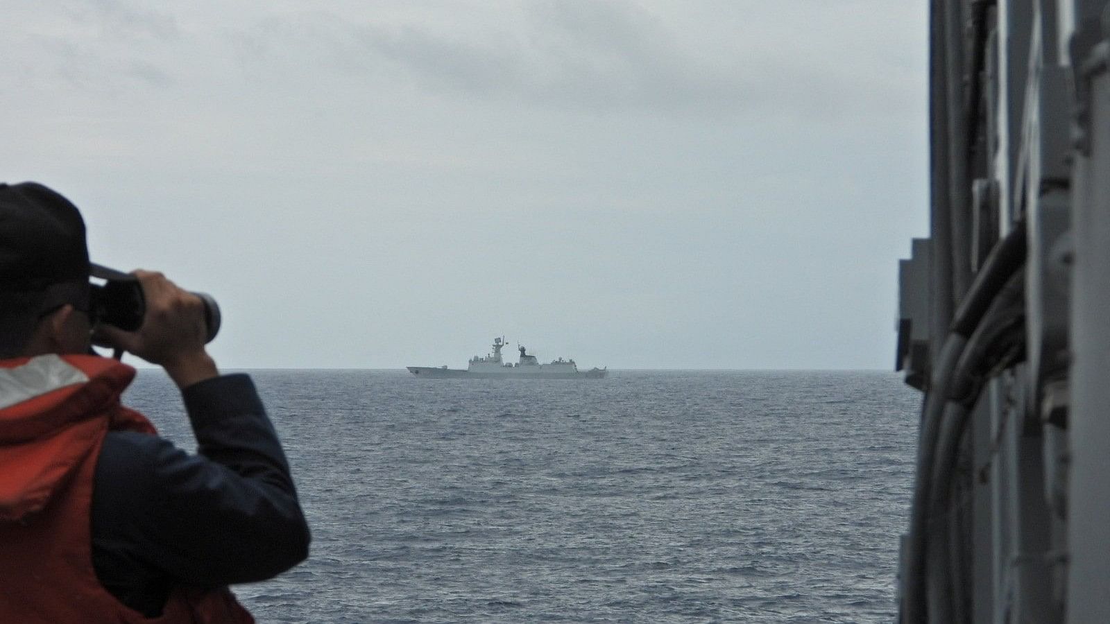 <div class="paragraphs"><p>A sailor monitors China's People's Liberation Army  Navy frigate Xuzhou from Taiwan's guided missile frigate Tian Dan at an undisclosed location, in this handout image provided by Taiwan Navy.</p></div>