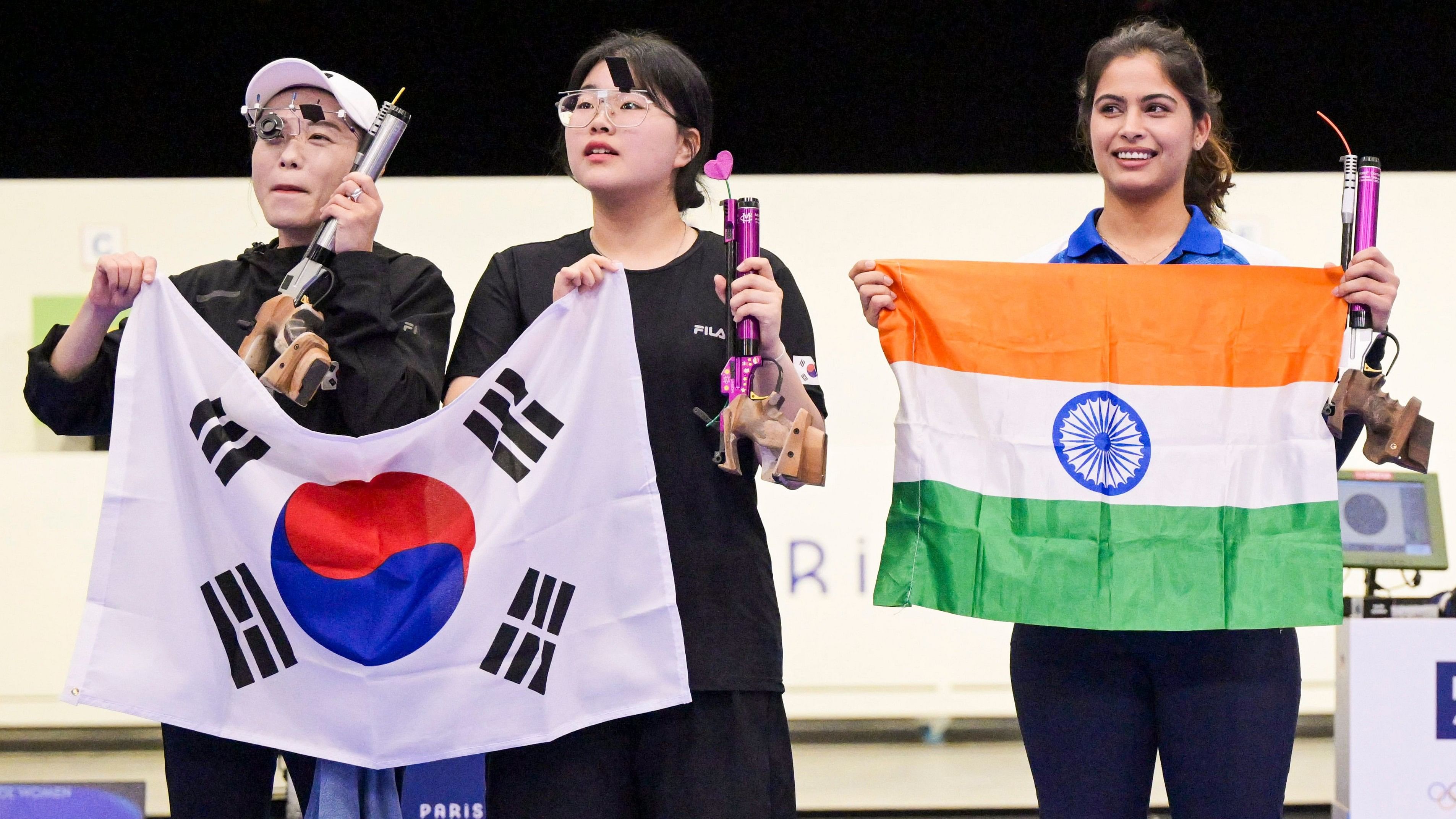 <div class="paragraphs"><p>Chateauroux: Gold Medallist Korea's Jin Ye Oh with her silver medallist compatriot Kim Yeji and bronze medallist India's Manu Bhaker after the 10m Air Pistol Women's Final event at the Summer Olympics 2024, in Chateauroux, France, Sunday, July 28, 2024. </p></div>