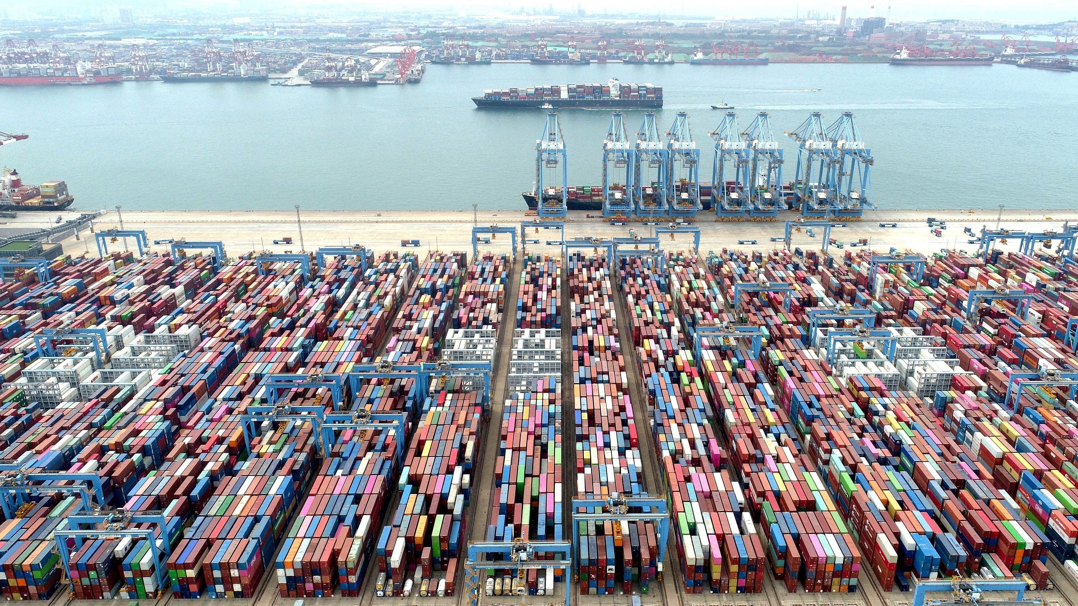 <div class="paragraphs"><p>Containers and cargo vessels at the Qingdao port</p></div>