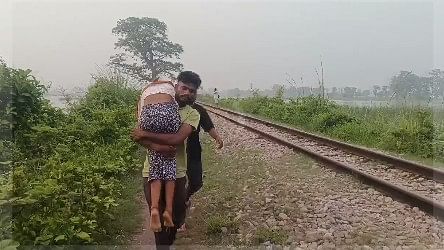 <div class="paragraphs"><p>Two men carrying their dead sister on their shoulders through flooded fields in Lakhimpur Kheri</p></div>