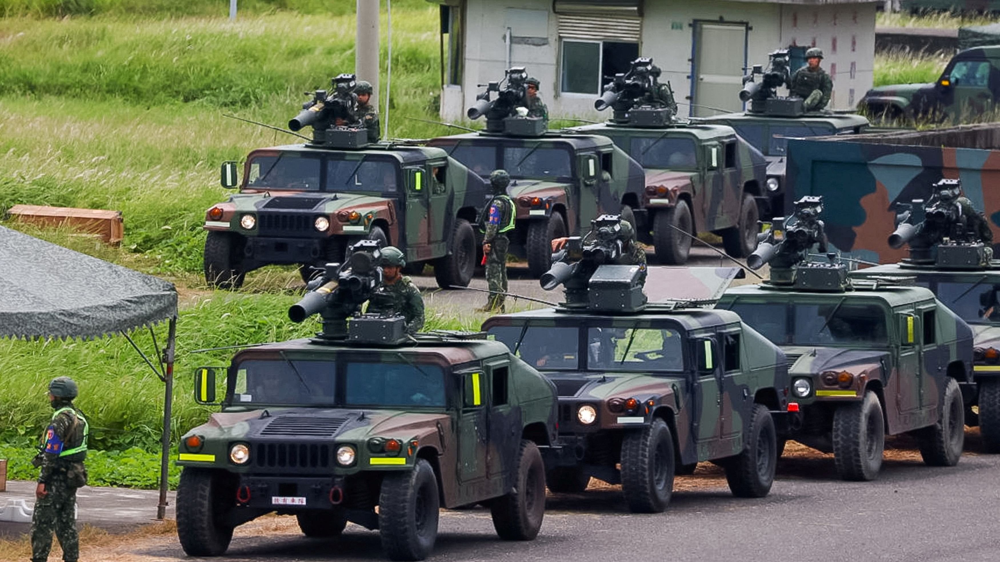 <div class="paragraphs"><p> Military vehicles equipped with US-made TOW 2A missiles can be seen during a live fire drill in Pingtung, Taiwan.</p></div>