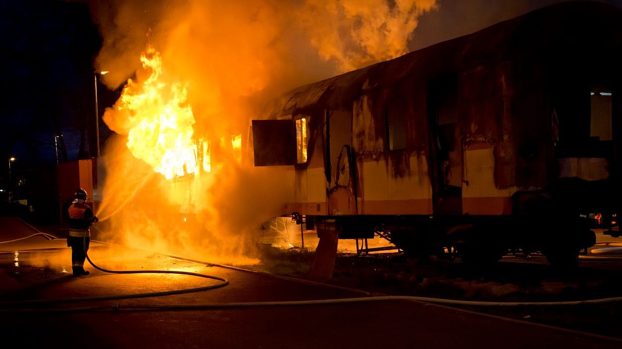 <div class="paragraphs"><p>Representative image showing a train compartment on fire.</p></div>