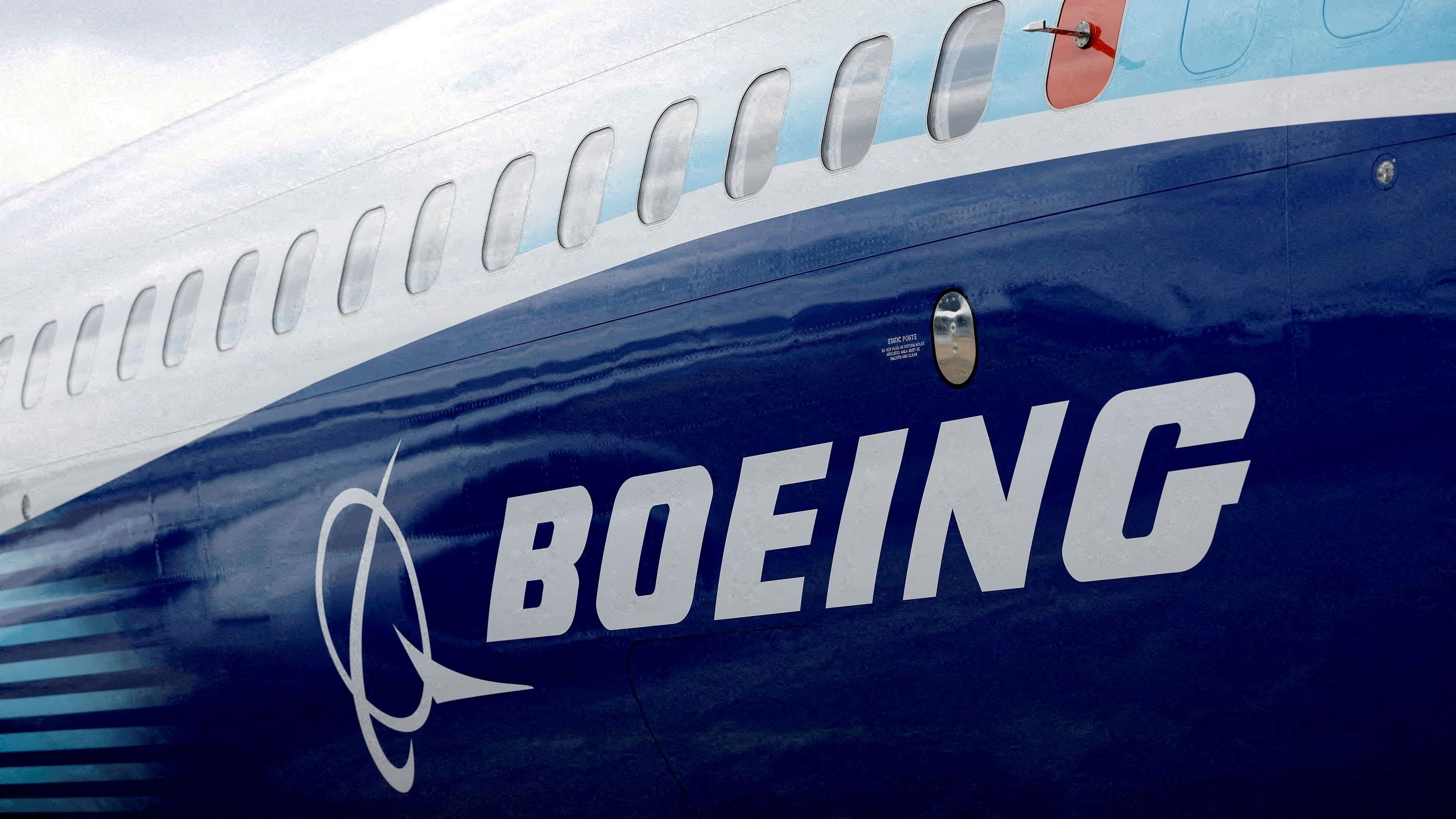 <div class="paragraphs"><p>The Boeing logo is seen on the side of a Boeing 737 MAX.</p></div>