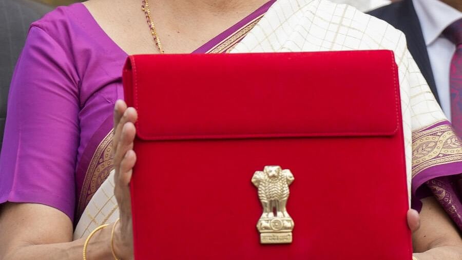 <div class="paragraphs"><p>Union Finance Minister Nirmala Sitharaman showcases a tablet wrapped in a red pouch carrying the Budget documents.</p></div>