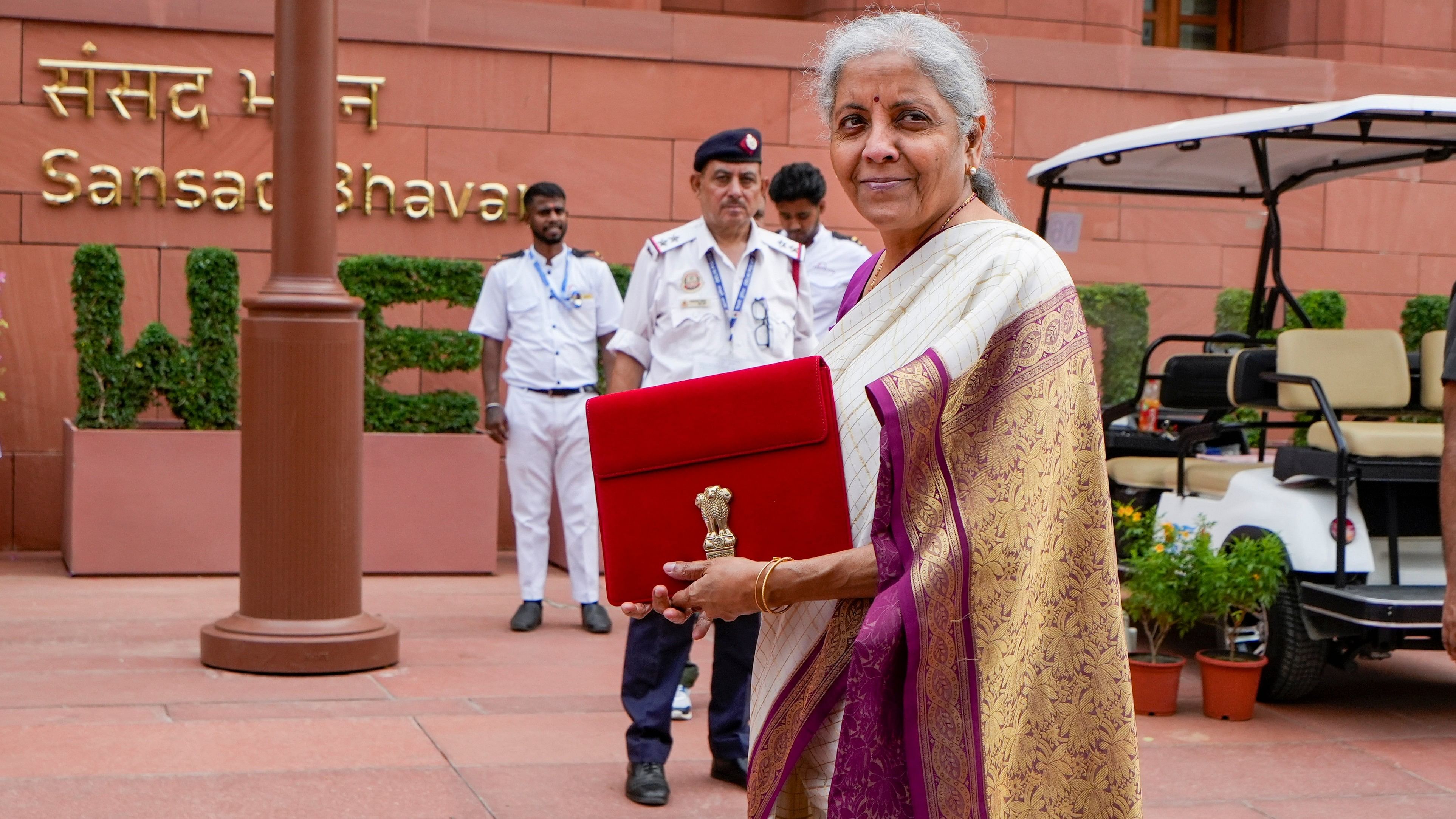 <div class="paragraphs"><p>Union Finance Minister Nirmala Sitharaman with a red pouch carrying the Budget documents arrives at the Parliament to present the Union Budget 2024-25, in New Delhi</p></div>