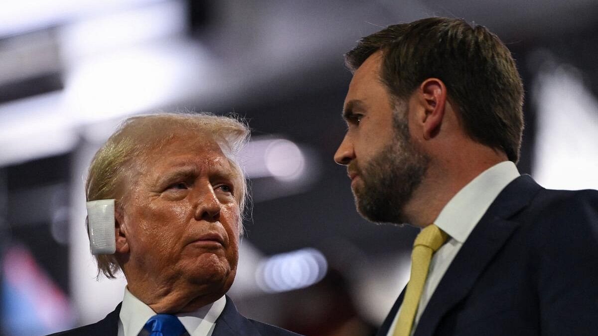 <div class="paragraphs"><p>Republican presidential nominee and former US President Donald Trump speaks with Republican vice presidential nominee J D Vance on during Day 2 of the Republican National Convention (RNC), at the Fiserv Forum in Milwaukee, Wisconsin, US, July 16, 2024.</p></div>