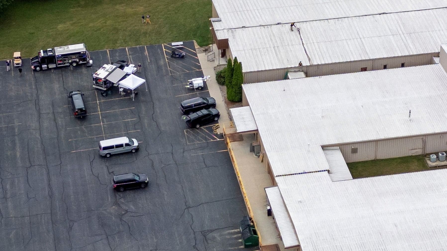 <div class="paragraphs"><p>FBI investigators inspect what appears to be a bloodstain on a rooftop where a gunman had been positioned during the law enforcement investigation into gunfire at a campaign rally of Republican presidential candidate and former US President Donald Trump in Butler, Pennsylvania, US.</p></div>