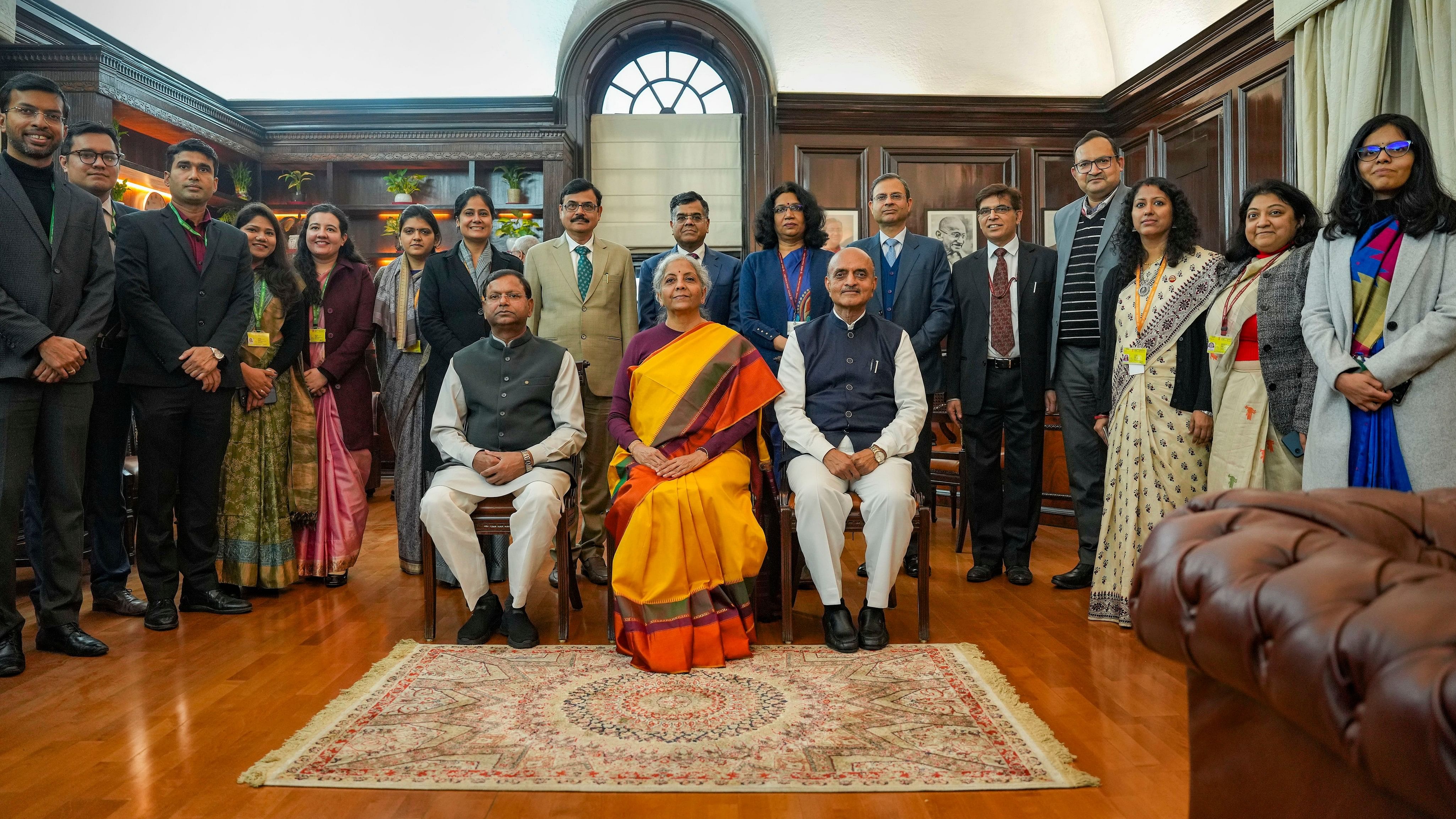 <div class="paragraphs"><p>Union Finance Minister Nirmala Sitharaman with Ministers of State Pankaj Chaudhary and Bhagwat Karad and her team of officials a day before presentation of the Interim Budget 2024, at her North Block office in New Delhi, Wednesday, Jan. 31, 2024. </p></div>