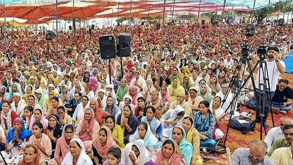 <div class="paragraphs"><p> Devotees at the religious gathering where a stampede broke out, in Hathras district.</p></div>