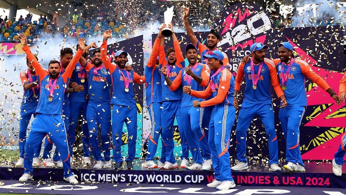 <div class="paragraphs"><p>Indian cricketers celebrate with the T20 World Cup trophy.</p></div>