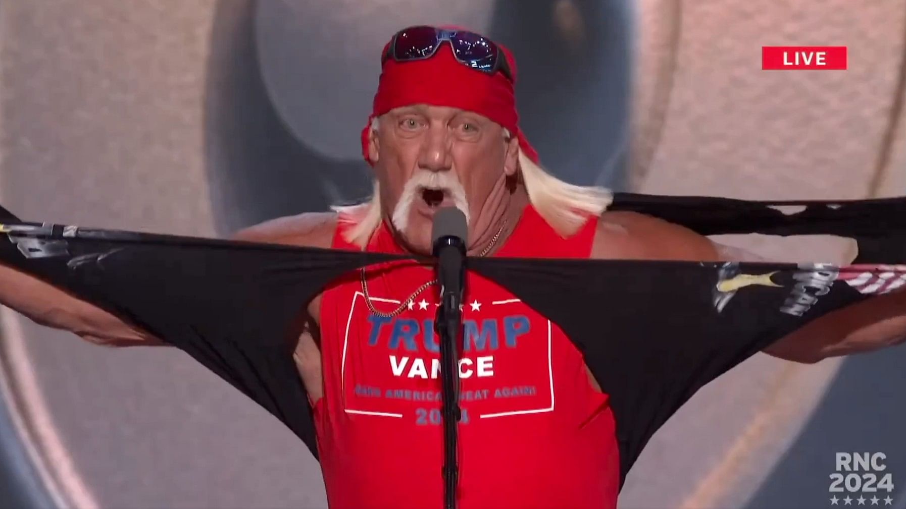 <div class="paragraphs"><p>Screengrab of video showing Hulk Hogan tearing off his shirt at the RNC event</p></div>