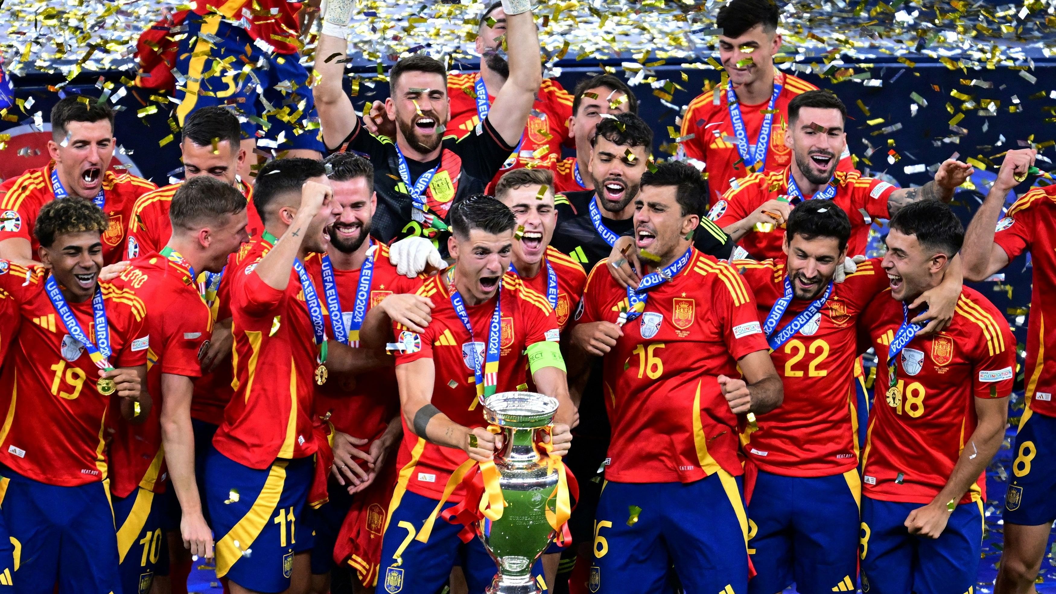 <div class="paragraphs"><p>Spain's Alvaro Morata lifts the trophy as he celebrates with teammates after winning Euro 2024.</p></div>