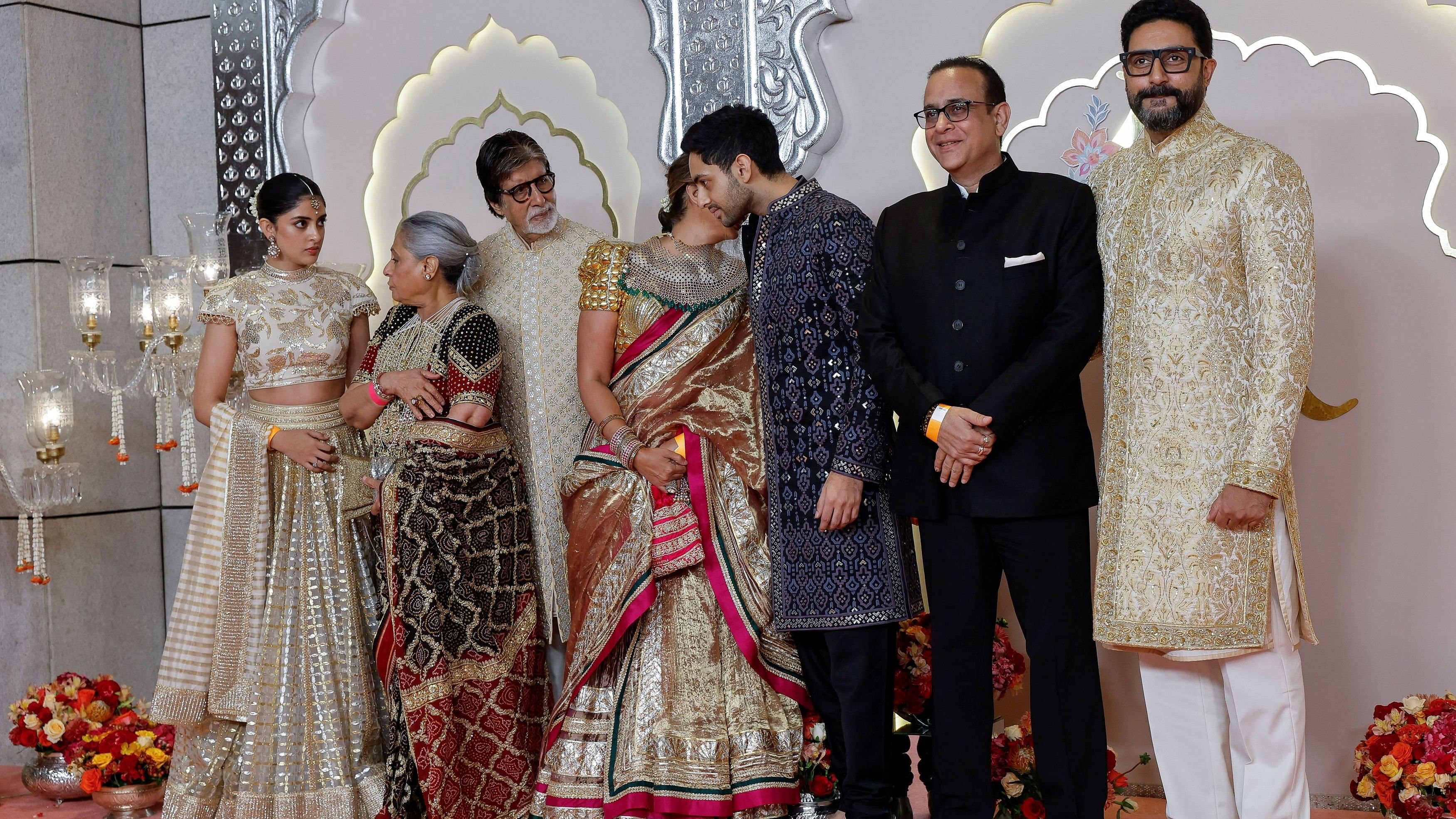 <div class="paragraphs"><p>Actor Amitabh Bachchan and his family pose for pictures on the red carpet on the day of the wedding of Anant Ambani and Radhika Merchant in Mumbai.</p></div>