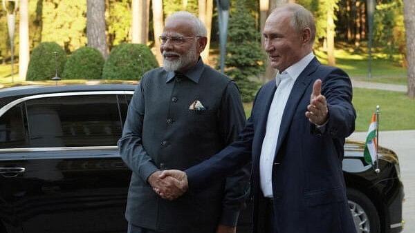 <div class="paragraphs"><p>Russia's President Vladimir Putin (R) and India's Prime Minister Narendra Modi (L) shake hands during their meeting at the Novo-Ogaryovo state residence near Moscow, Russia.</p></div>