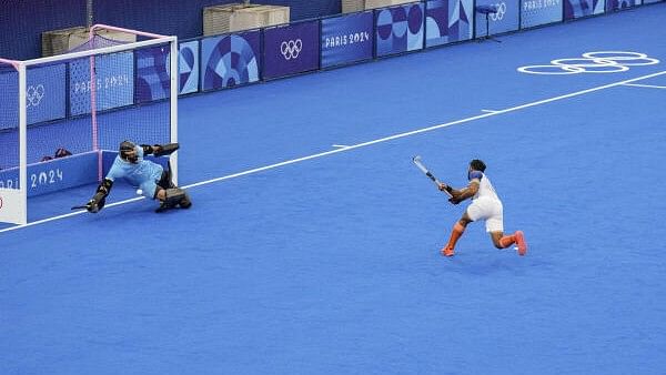 <div class="paragraphs"><p>India's Harmanpreet Singh celebrates after scoring a goal from a penalty stroke against New Zealand during the Pool B hockey match between India and New Zealand, at the Summer Olympics 2024, in Paris, Saturday, July 27, 2024.</p></div>