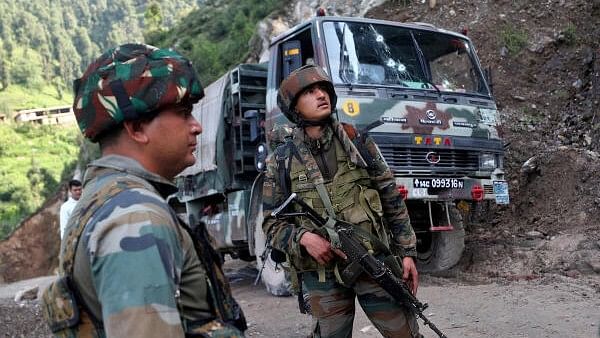 <div class="paragraphs"><p>Soldiers stand next to a vehicle after an attack by suspected militants on an Indian Army convoy in Kathua district of Jammu and Kashmir, July 9, 2024.</p></div>