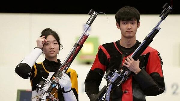 <div class="paragraphs"><p>Yuting Huang of China and Lihao Sheng (R) of China pose with their weapons after winning the 10m Air Rifle Mixed Team Gold Medal at the Chateauroux Shooting Centre, Dols, France&nbsp; on July 27, 2024.</p></div>