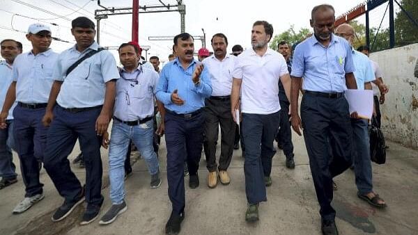 <div class="paragraphs"><p>Leader of Opposition Rahul Gandhi meets the loco pilots at New Delhi Railway Station, in New Delhi.</p></div>