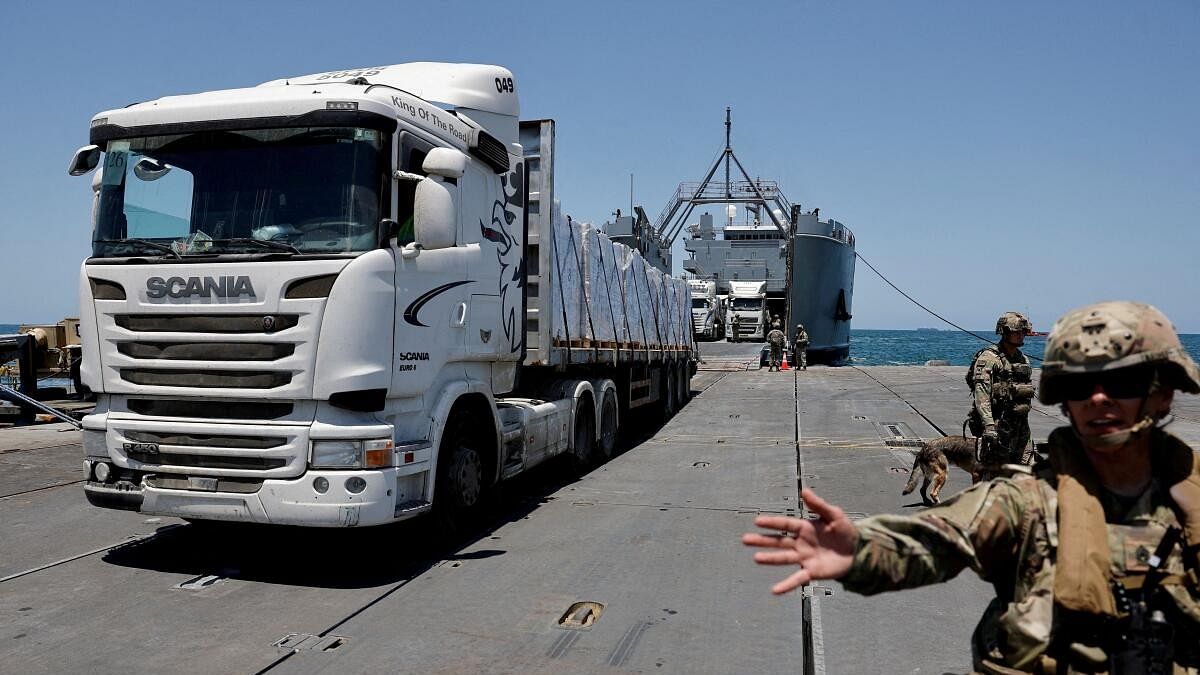 <div class="paragraphs"><p>A truck carries humanitarian aid across Trident Pier, a temporary pier to deliver aid, off the Gaza Strip, amid the ongoing conflict between Israel and Hamas, near the Gaza coast.</p></div>