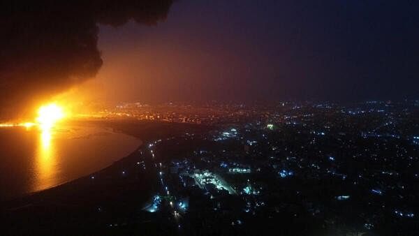 <div class="paragraphs"><p>Smoke rises from a fire following an Israeli air strike in Hodeidah, Yemen in this handout photo released on July 20, 2024. </p></div>