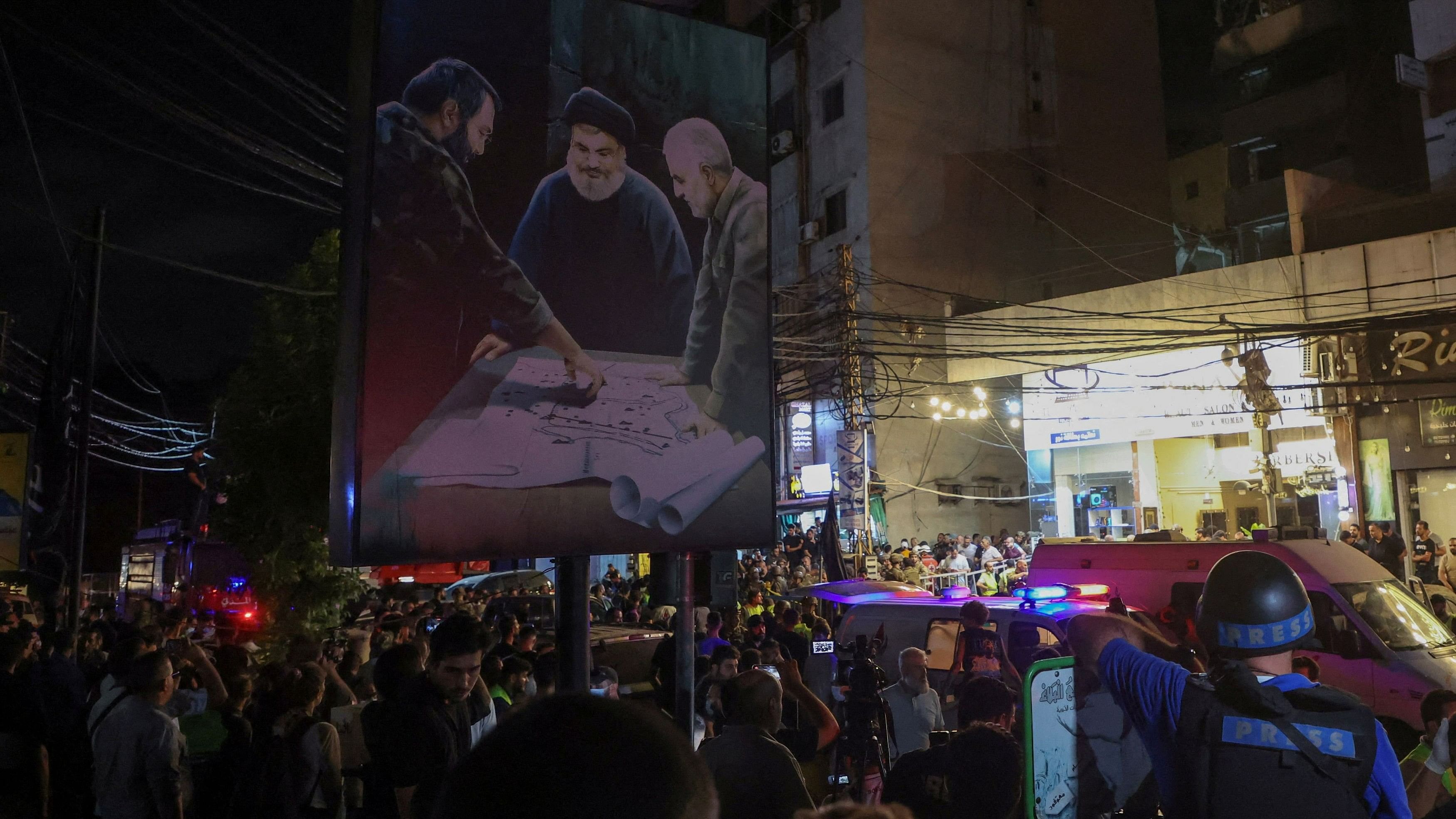 <div class="paragraphs"><p>People gather near a damaged site after what security sources said was a strike on Beirut's southern suburbs, Lebanon July 30, 2024.</p></div>