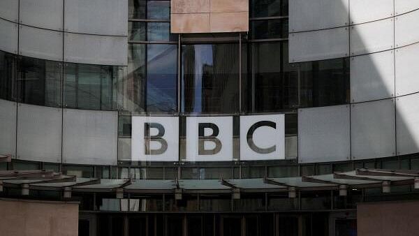 <div class="paragraphs"><p>The BBC logo is displayed above the entrance to the BBC headquarters in London, Britain,.</p></div>