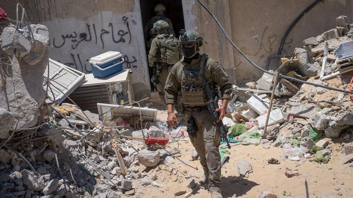 <div class="paragraphs"><p>Israeli soldiers operate during a ground operation in the southern Gaza Strip, amid the Israel-Hamas conflict.</p></div>