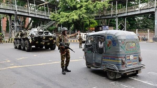 <div class="paragraphs"><p>Members of the Bangladesh Army are seen on duty on the second day of curfew, as violence erupted in parts of the country after protests by students against government job quotas, in Dhaka, Bangladesh, July 21, 2024.</p></div>