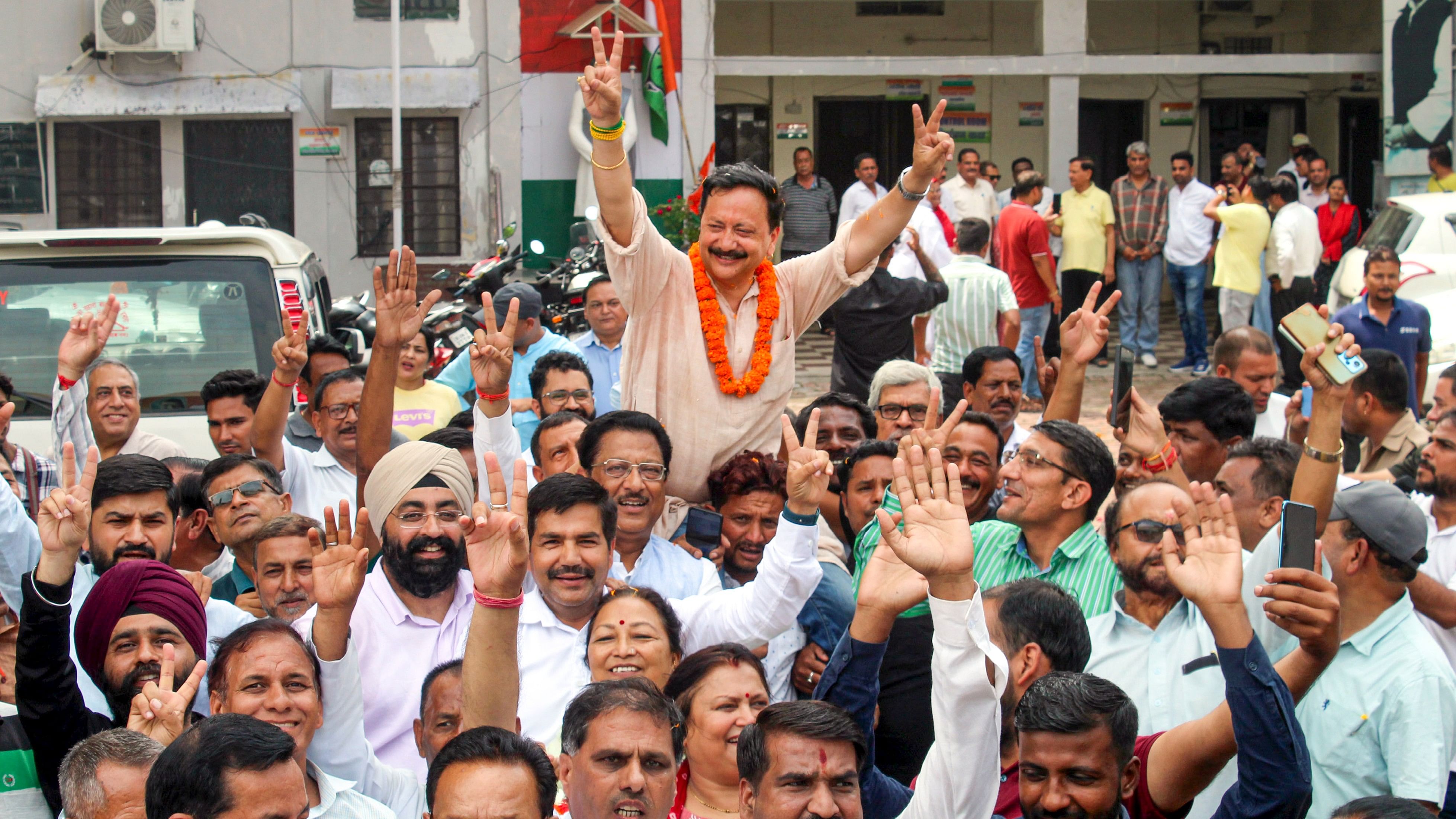 <div class="paragraphs"><p>Uttarakhand Congress President Karan Mahara celebrates with party workers after party's victory in the State Assembly by-elections, in Dehradun, Saturday</p></div>