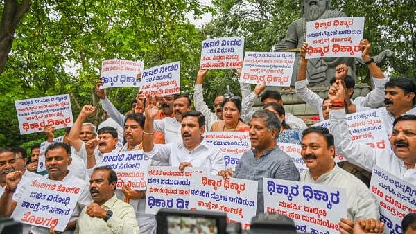 <div class="paragraphs"><p>B Y Vijayendra, BJP State President, R Ashoka, Opposition party leader and BJP MLA, MLC’s staging protest and rally against state Government miss apportion founds in Valmiki Nigama, SC ST Corporation and others in front of Maharshi Valmiki statue.&nbsp;</p></div>