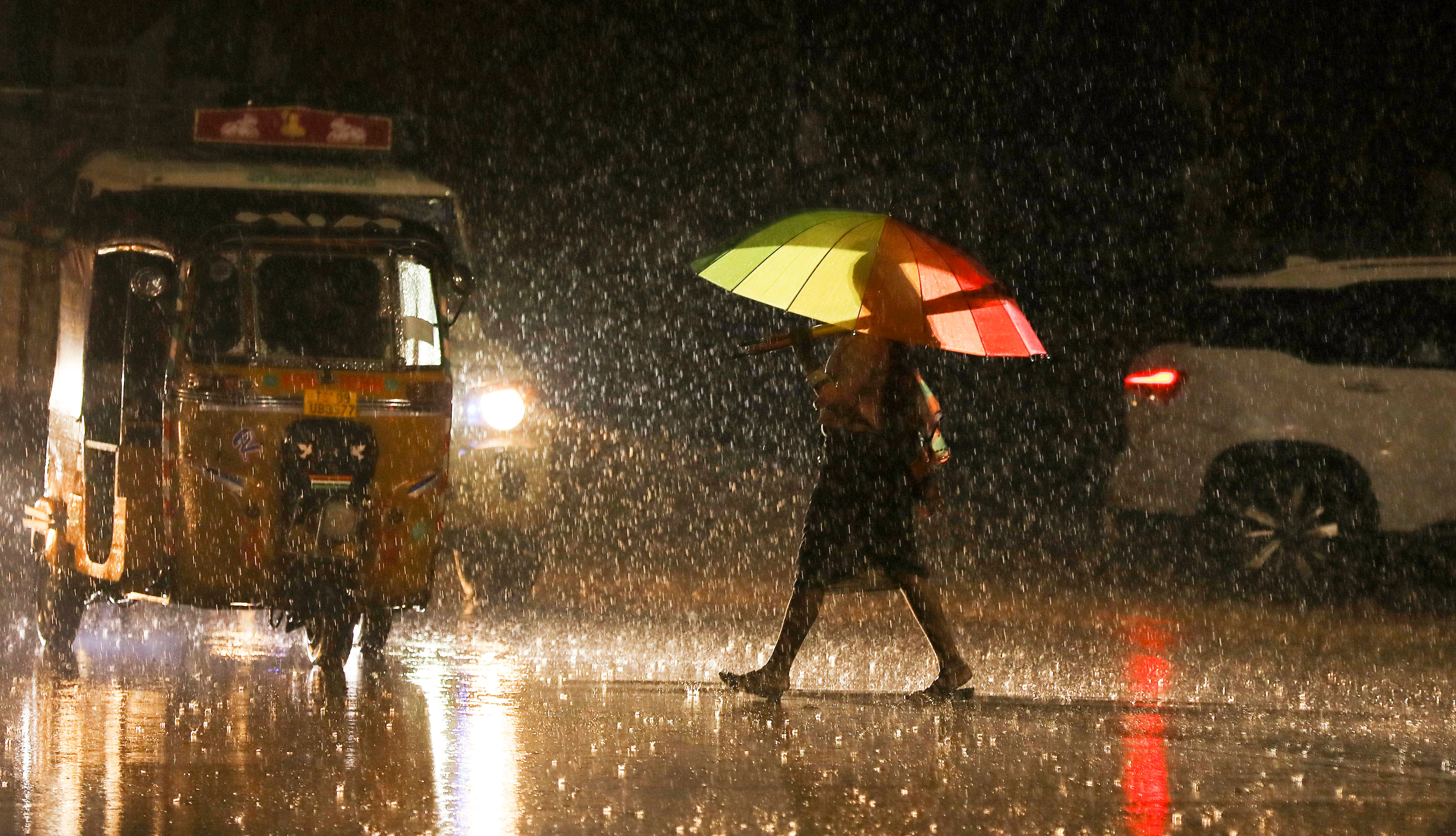 <div class="paragraphs"><p>A man walks past vehicles during rain. Image for representational purposes.</p></div>