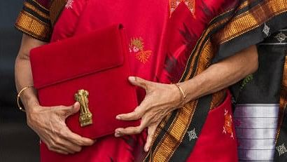 <div class="paragraphs"><p>Finance Minister Nirmala Sitharaman holds a case containing a tablet device, during the Budget Session of the Parliament. (Union Budget 2023-2024)</p></div>