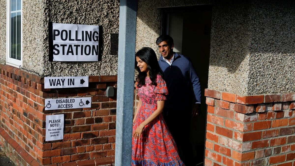 <div class="paragraphs"><p>British Prime Minister Rishi Sunak and his wife Akshata Murty, walk outside a polling station during the general election in Northallerton, Britain, July 4, 2024.</p></div>