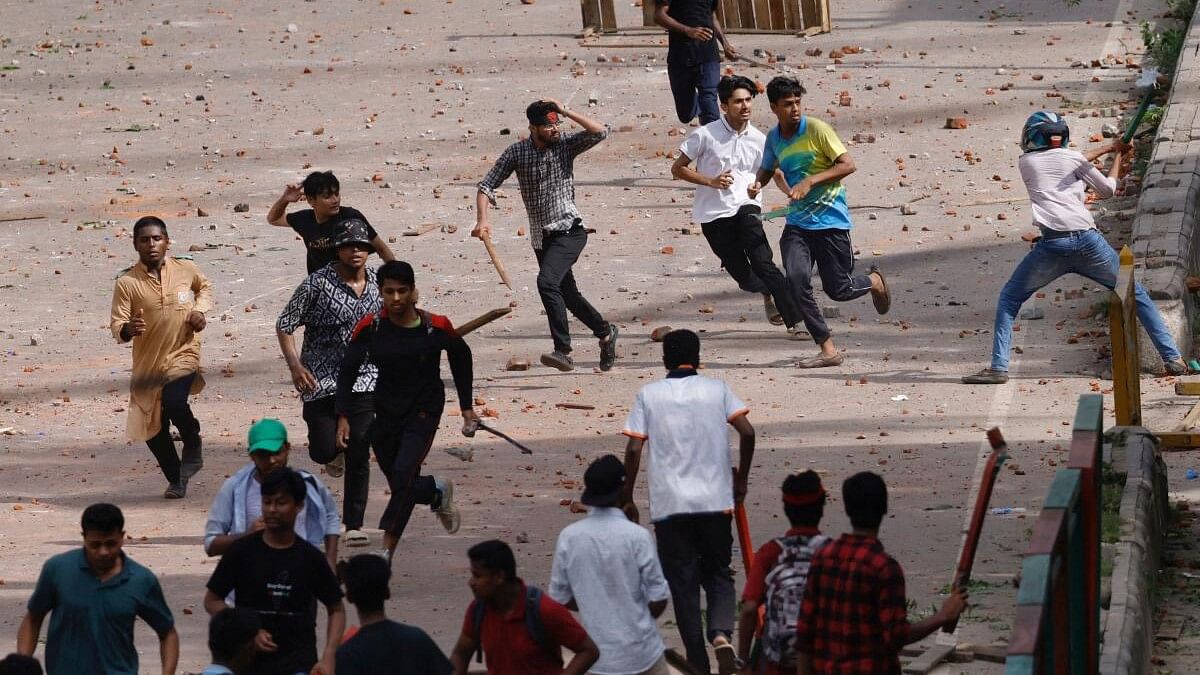 <div class="paragraphs"><p>Bangladesh Chhatra League, the student wing of the ruling party Bangladesh Awami League, and anti-quota protesters engage in a clash at the Dhaka College area, in Dhaka, Bangladesh.</p></div>