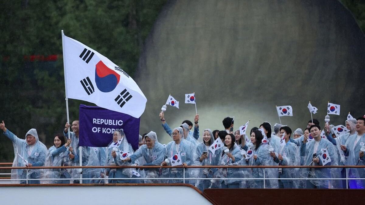 <div class="paragraphs"><p>Athletes of South Korea aboard a boat in the floating parade on the river Seine during the opening ceremony.</p></div>