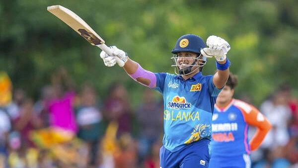 <div class="paragraphs"><p>Sri Lanka’s captain Chamari Athapaththu celebrates her half century during the Women’s Asia Cup final T20 International cricket match between India and Sri Lanka, in Dambulla, Sunday, July 28, 2024.</p></div>