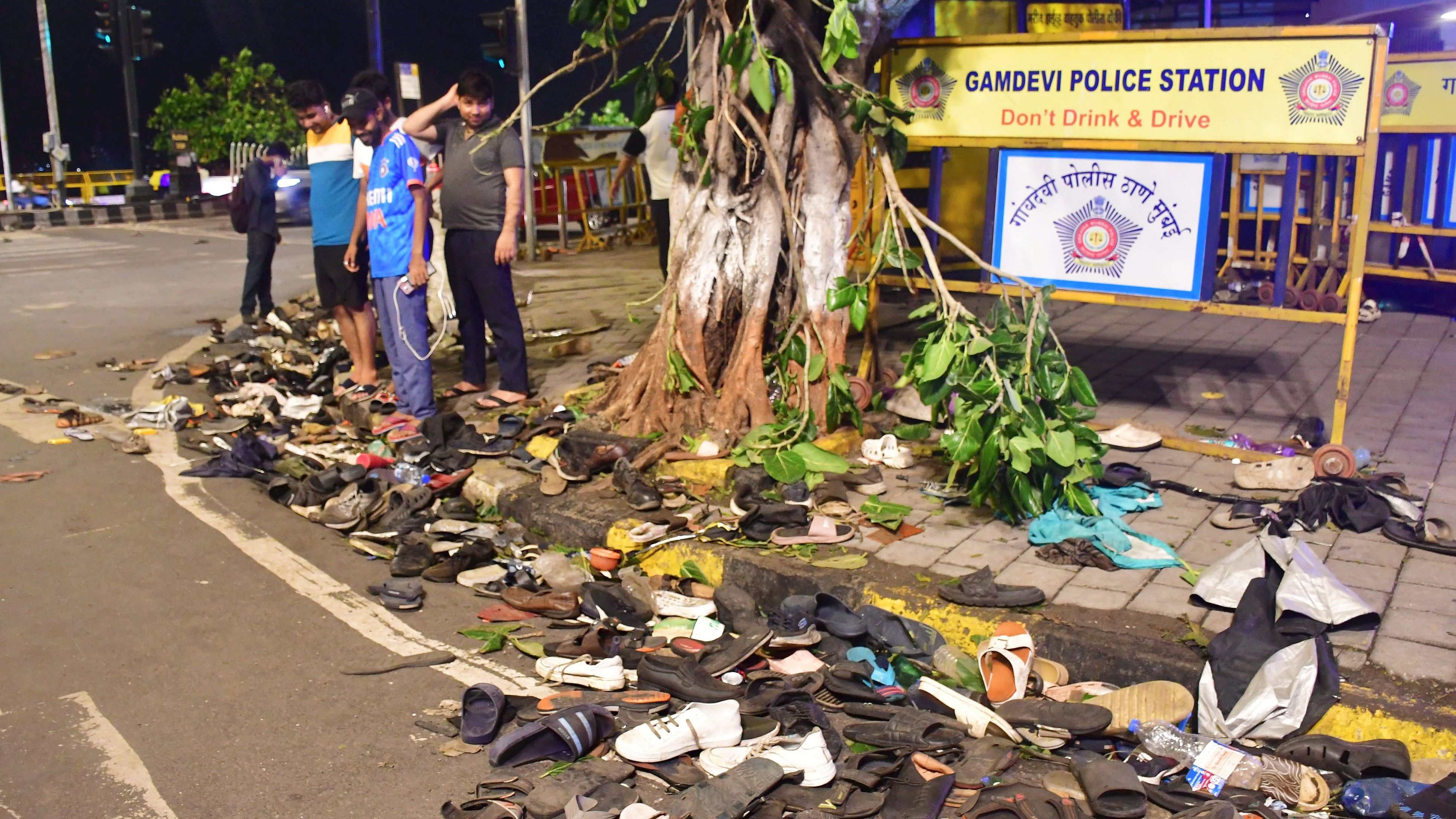 <div class="paragraphs"><p>Footwears of public lying along a road near Marine Drive after the victory parade of the Indian men's team which won the T20 World Cup 2024, in Mumbai, on Thursday.</p></div>