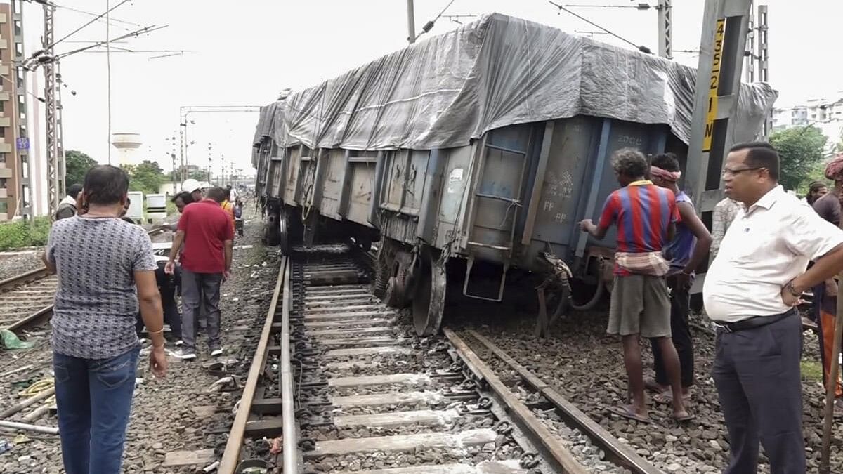 <div class="paragraphs"><p>People near the derailed coach of a goods train, in Bhubaneswar, Friday, July 26, 2024.</p></div>