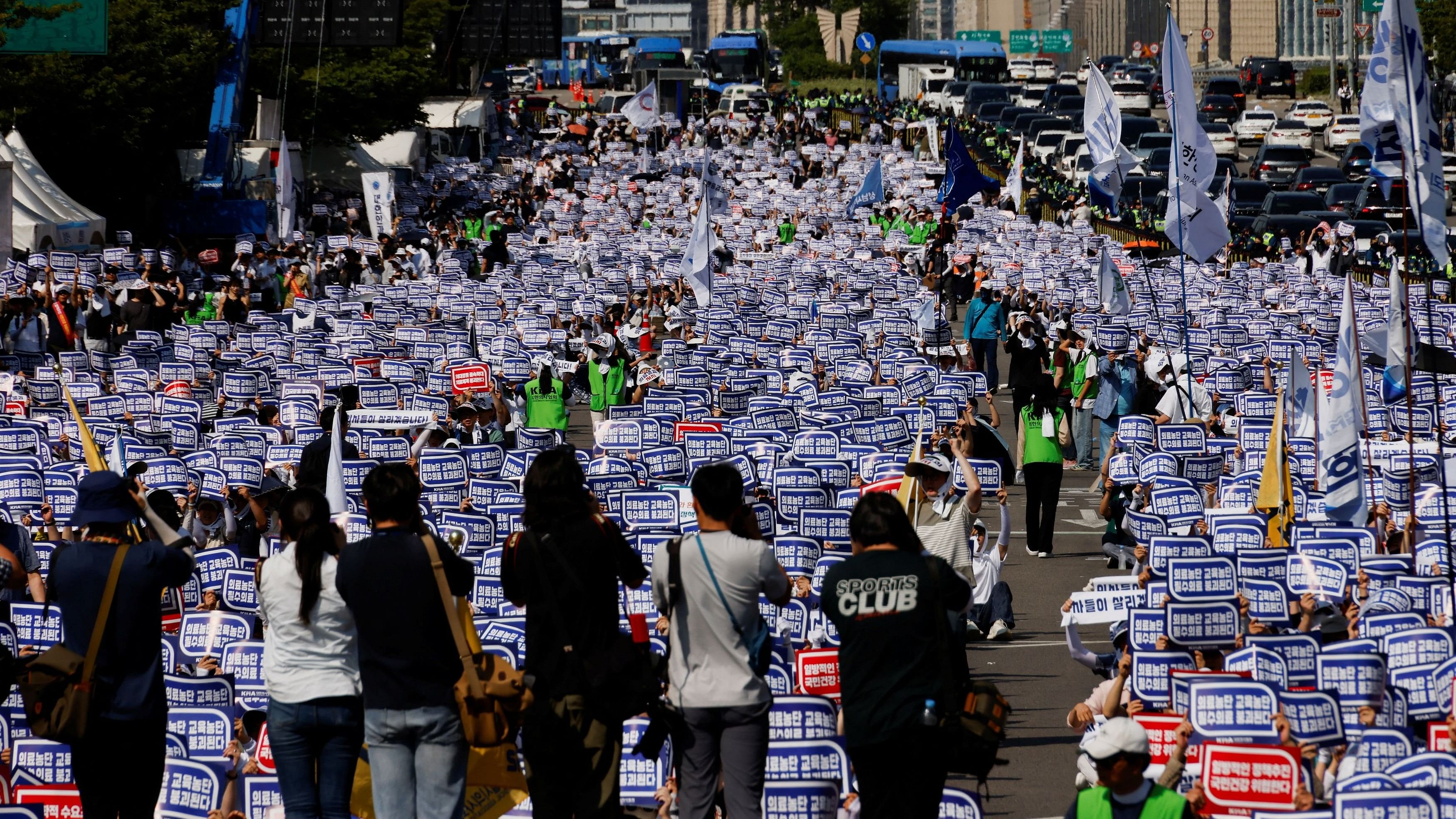 <div class="paragraphs"><p>Doctors strike and shout slogans during a rally to protest against government plans to increase medical school admissions and healthcare reform in Seoul, South Korea, June 18, 2024. </p></div>