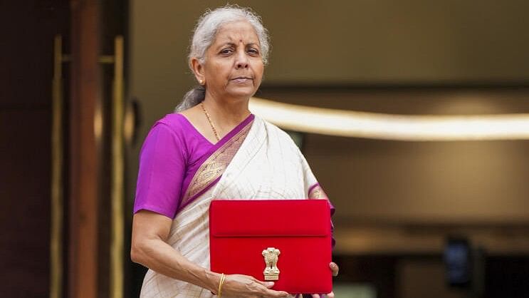 <div class="paragraphs"><p>Union Finance Minister Nirmala Sitharaman with a red pouch carrying the Budget documents arrives at the Parliament to present the Union Budget 2024-25, in New Delhi, Tuesday, July 23, 2024. </p></div>