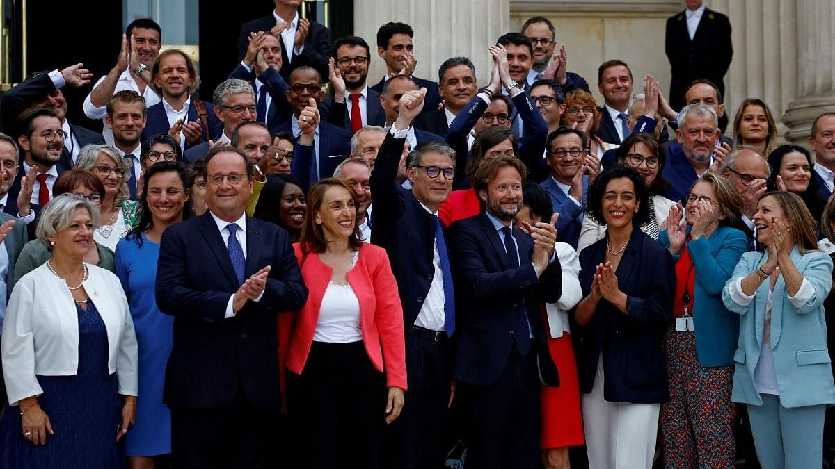 <div class="paragraphs"><p>Former French President Francois Hollande, Member of Parliament of the French Socialist Party and the left-wing parties alliance named "Nouveau Front Populaire" (New Popular Front - NFP), poses for a family photo with Olivier Faure, First Secretary of the French Socialist Party (PS), Boris Vallaud, and newly-elected PS lawmakers as they arrive at the National Assembly in Paris following the second round of the early French parliamentary elections, France, July 9, 2024. </p></div>